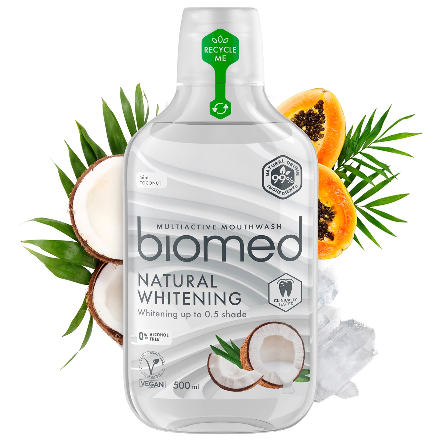 Biomed Natural Whitening -suuvesipullo kookospähkinöiden, papaijan ja palmunlehtien keskellä