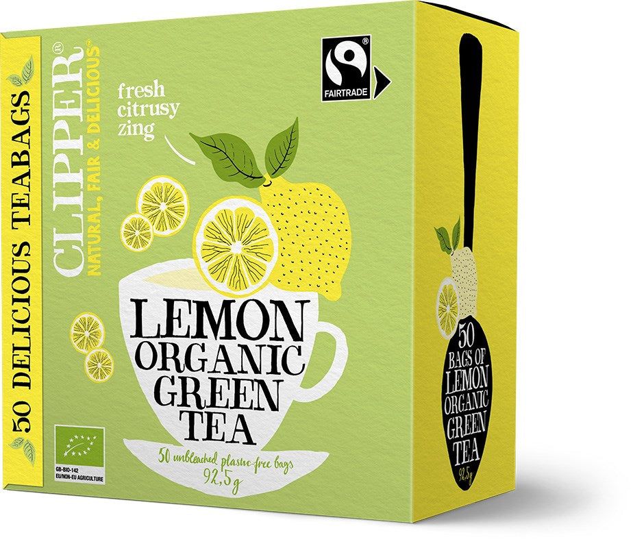 A yellow and green rectangular box of Clipper Lemon Organic Green Tea with matte finish, showing stylized lemon and leaf graphics. Bold sans-serif typography in white and black. The front label states 50 Fairtrade teabags, lemon flavor, plastic-free bags. No people or hands present. Plain background with a product-central studio shot. A yellow and green box of Clipper Lemon Organic Green Tea featuring lemon and leaf illustrations. The box contains 50 Fairtrade teabags and highlights a fresh, citrusy flavor