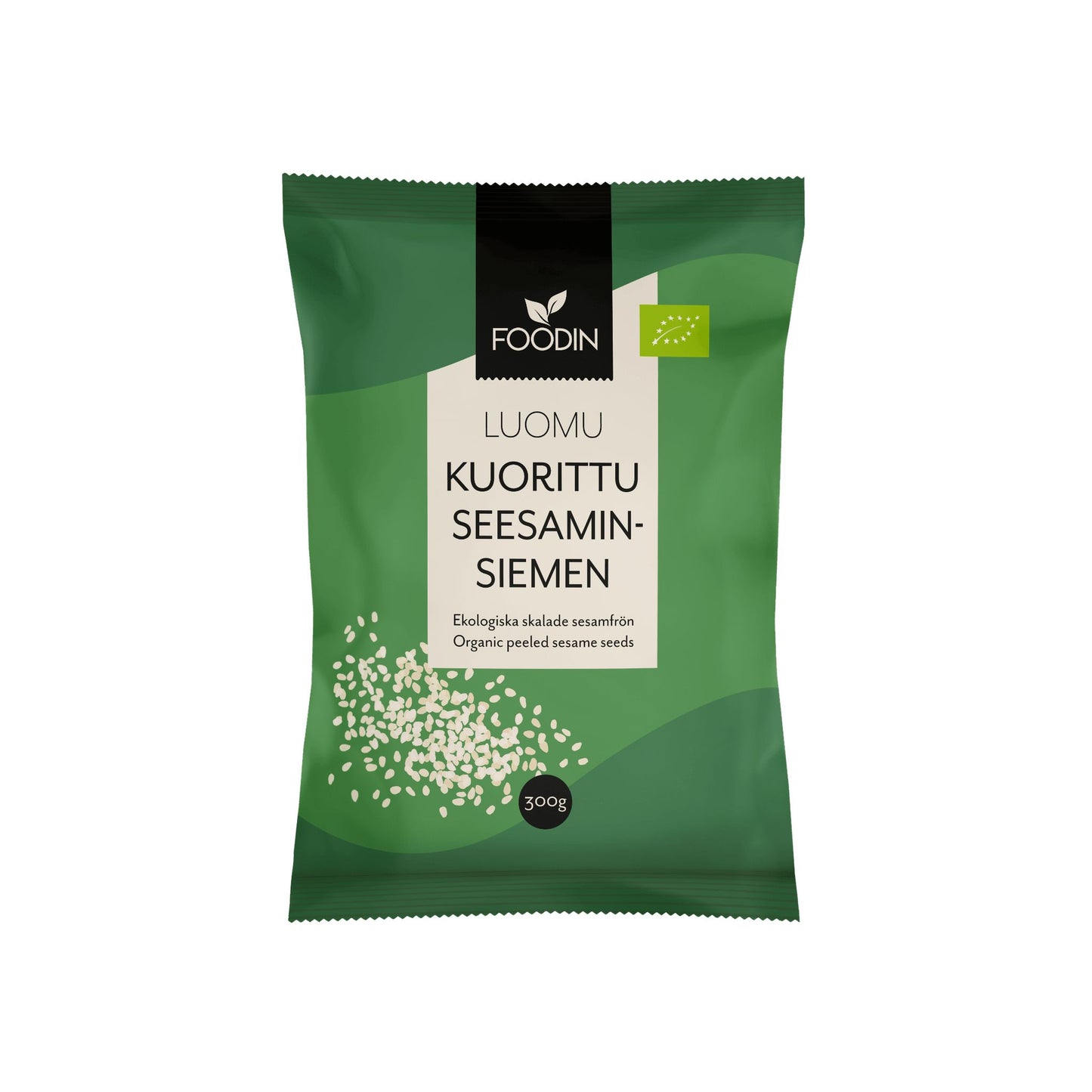 A green 300g package of Foodin organic peeled sesame seeds, featuring an illustration of seeds on the lower left and text in both Finnish and English on the front. Rectangular matte plastic pouch with a flat base; simple sans-serif fonts in white; visible product name and weight. No people or hands shown. Plain, light background with even lighting; shot is taken straight-on at eye level.