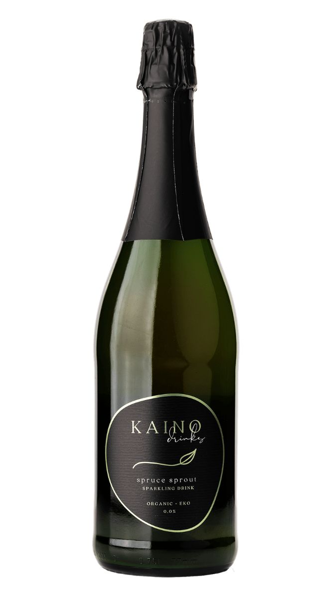 A dark green bottle with a black foil top and a black label, displaying Kaino Drinks and Spruce Sprout Sparkling Drink Organic 0.0%, offers an invigorating organic beverage experience. The bottle has a classic cylindrical shape with a glossy surface. The black label features white and green text in simple, modern fonts. No people or hands are present, and the background is plain white.