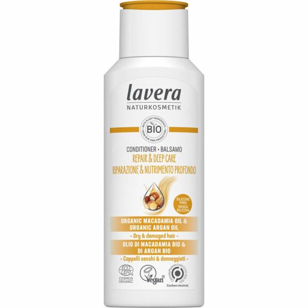 White bottle of Lavera Bio conditioner for dry and damaged hair, enriched with organic macadamia and argan oil. Vegan, gluten-free formula, with label text in English and Italian, plus certifications at the bottom. Bottle is cylindrical with a rounded white flip cap and has a matte finish. The main label shows black sans-serif typography; background is plain white. No people or additional objects are visible in the image.