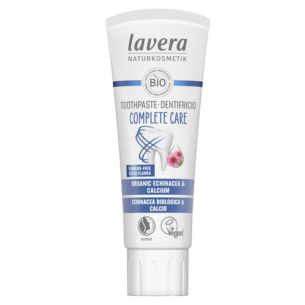 A white tube of Lavera Complete Care toothpaste featuring organic echinacea and calcium, labeled as fluoride-free, vegan, and certified natural, with blue and pink design elements for gentle oral hygiene. The tube is made of matte-finish plastic with a flip-top cap, predominantly white with blue and pink accents. Product name appears in sans-serif typeface on the front label. The photo shows only the tube against a plain background; there are no people or hands visible.