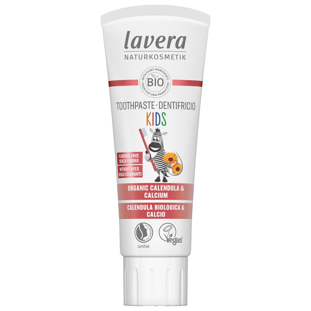 A tube of Lavera Kids Toothpaste with organic calendula and calcium, labeled vegan and certified, features a zebra cartoon holding a toothbrush and a yellow flower on the white packaging. The tube is upright, made of glossy plastic, with colorful childlike illustrations and clear sans-serif type in various colors. Background is neutral; no people or hands are present.