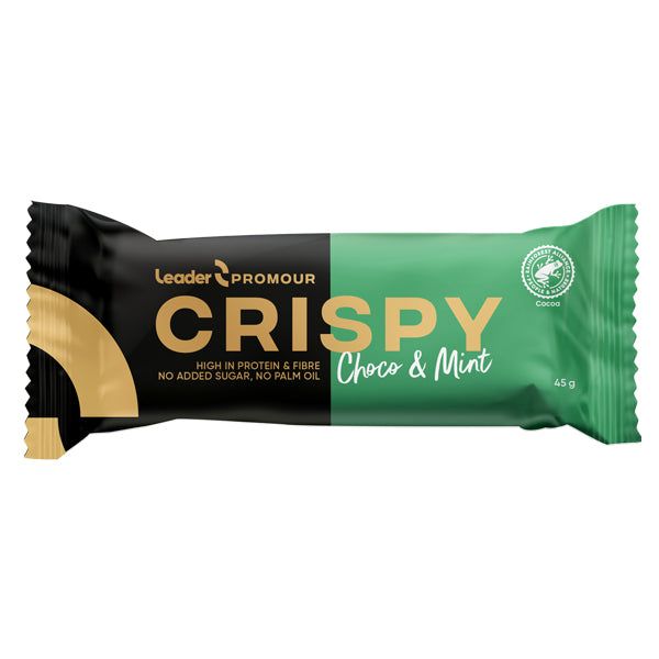 A wrapped Leader Promour Crispy Choco & Mint bar, 45g. The packaging is black and green with gold accents, in a matte plastic wrapper. The shape is rectangular with sealed ends. Sans serif typography displays the product name and features: high protein, fibre, no added sugar, no palm oil. Product only; plain background; no people or props visible.