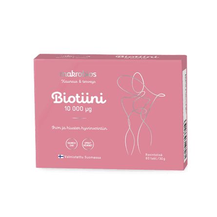 A pink box of Makrobios Biotiini 10,000 µg supplements features a minimalist line drawing of a person, a Finnish flag icon, and text indicating it is made in Finland with 60 tablets per box. The surface finish is matte. Packaging is rectangular cardboard. Main fonts are bold sans-serif for the product name and smaller sans-serif for details. Background is plain white; no people or hands visible; standard front-facing product shot.