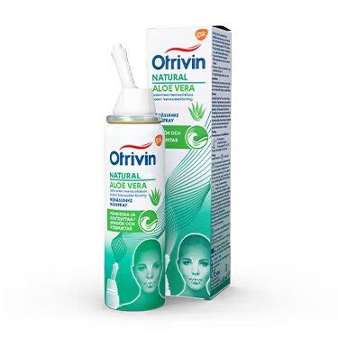 Otrivin Natural Aloe Vera nasal spray bottle with applicator, shown in front of its box. The packaging is white and green, made of glossy cardboard for the box and plastic for the bottle. Both display legible product text and a stylized face graphic. Typography is sans-serif. The background is plain white, no people or hands are present, shot is straightforward front view.