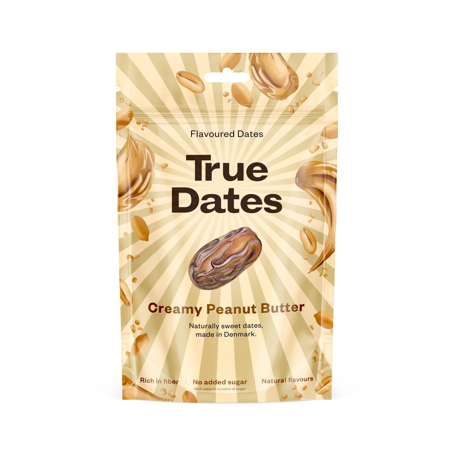 A beige pouch labeled True Dates with creamy peanut butter flavor, featuring peanuts, peanut butter swirls, and a date on the front. The packaging surface is matte. Font for the main label is bold and sans-serif, with additional text in smaller font listing no added sugar and natural flavors. Background is plain white. No people or hands visible. Medium close-up product shot.