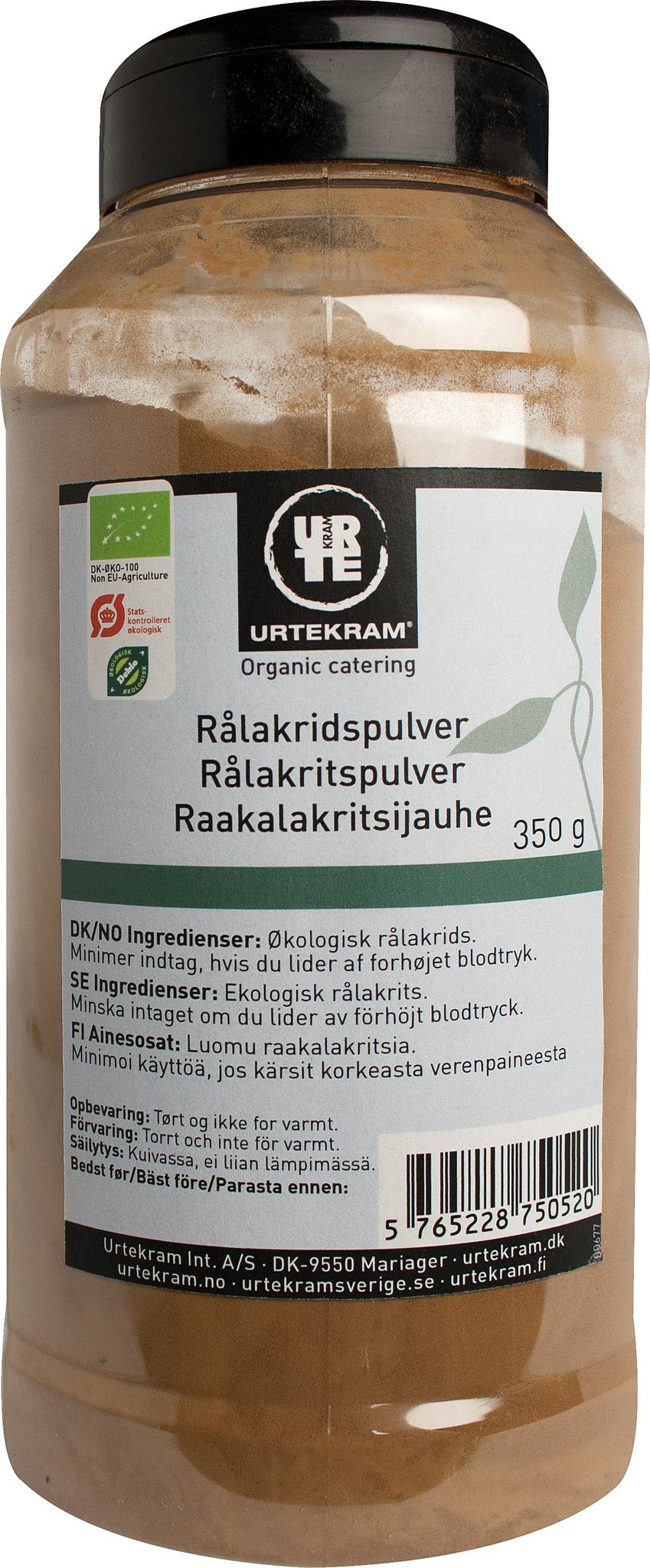 A jar of Urtekram organic catering licorice powder with multilingual labeling, ingredients, and nutritional advice on the front. The cylindrical plastic jar has a black matte screw-top lid. Label includes block sans-serif text and a barcode in the bottom right corner. The packaging indicates organic certification marks. Plain, neutral background with no people or hands visible in the image.
