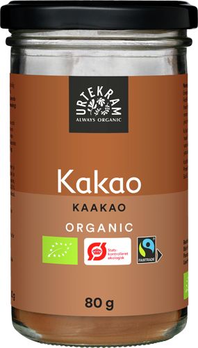 Urtekram Luomu Kaakao -purkki, 80 g; sylinterimäinen, vaaleanruskea ja mattapintainen purkki metallisella kannella; etiketissä lihavoitu valkoinen teksti "Kakao Kaakao Organic" sekä Fairtrade- ja luomusertifiointimerkit; kuvattu tasaisella alustalla yksiväristä taustaa vasten, ei ihmisiä tai käsiä näkyvissä.