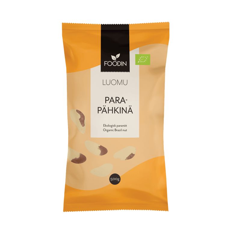 A 500g orange and beige package of Foodin organic Brazil nuts features a clear window displaying the nuts and text in both Finnish and English. Matte flexible pouch, rectangular shape. Sans-serif typeface in white and black, “Foodin” logo on top. Product weight printed at lower section. Plain studio background, no people or extra objects visible.