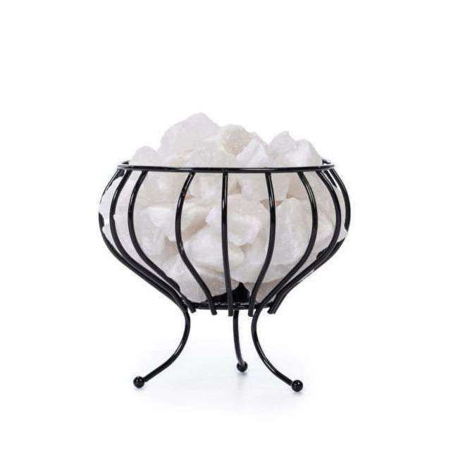 A decorative black metal bowl with curved legs holds several large, white quartz crystals against a white background. The bowl has a matte finish and no visible patterns or labels. The curved legs raise the container above the surface. No packaging, text, or branding is visible in the image. The angle is straight-on with even lighting; there are no people or props included.