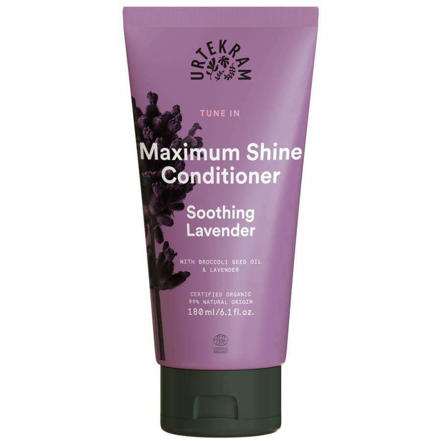 A purple tube of Urtekram Maximum Shine Conditioner, Soothing Lavender, with nourishing broccoli seed oil and lavender, 180 ml. The tube features lavender graphics and white text on the front. Plastic packaging; matte surface; cylindrical shape with a flat cap at the base. Sans-serif font in uppercase used for product name. No people or hands visible. Neutral, solid-colored background; full product in frame.