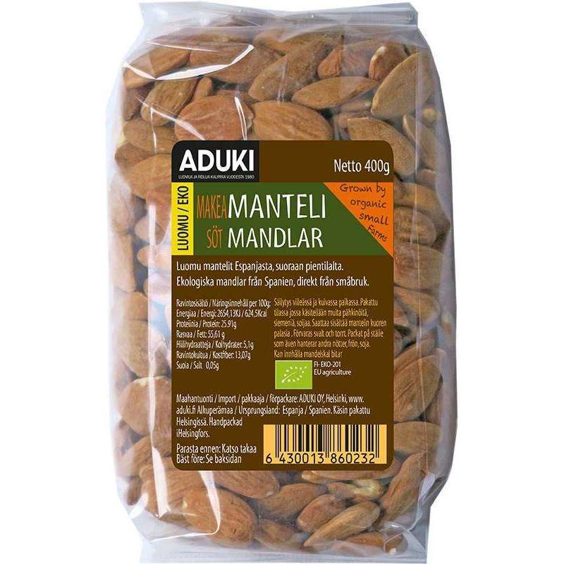 Aduki Luomu Manteli -pussi, kirkas muovi, vihreä-ruskea suorakulmainen etiketti Aduki-brändinimellä; mantelit näkyvissä vaaleanruskeina, teksti useilla kielillä, kiiltäväpintainen pakkaus