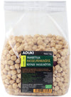 A clear plastic bag filled with roasted hazelnuts. Rectangular, transparent packaging with a glossy finish. The label is black and white with bold sans-serif “ADUKI” text; other visible details include Finnish and Swedish wording, a green eco symbol, and net weight of 1 kg. Neutral background; no people or hands present.
