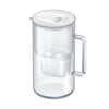 A clear plastic water filter pitcher with a white lid and a convenient handle, shown on a plain light background. The pitcher has smooth, curved sides and a matte finish on the handle. There is no visible label text or additional packaging in the image. No people or hands are present in the shot.