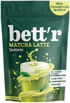 Bett'r Matcha Latte Instant -juomajauhe, vihreä pussi ja lasi vaaleanvihreää matcha lattea