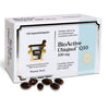 A box of BioActive Ubiquinol Q10 dietary supplements with 150 capsules. Five dark, oval softgel capsules are arranged on a smooth surface in front of the box, next to a silver blister pack. The packaging is matte with prominent block lettering and blue accents. Visible text is in Finnish and Swedish. All items are photographed against a plain white background in a clear product shot.