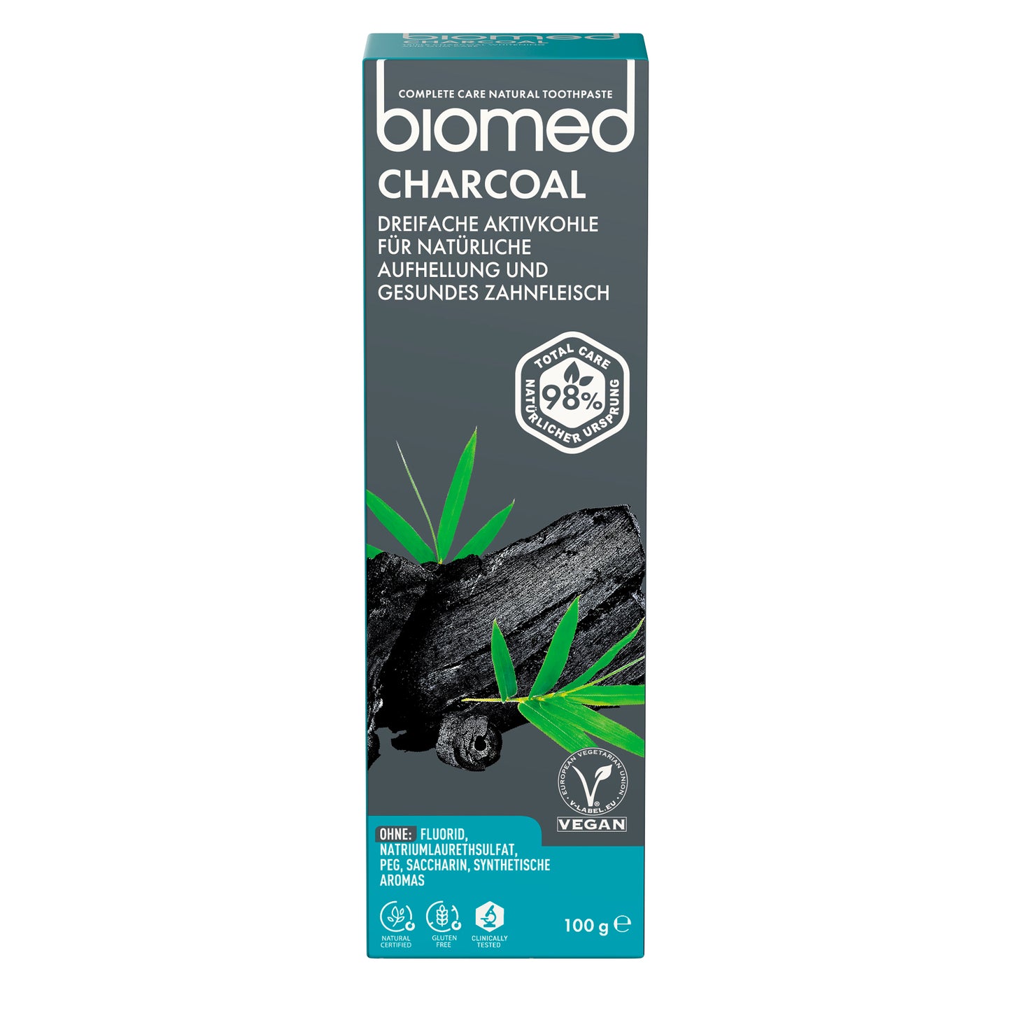 Biomed Charcoal -pakkauksen etupuoli: 98 % luonnollista alkuperää, vegaaninen, fluoriton, 100 g