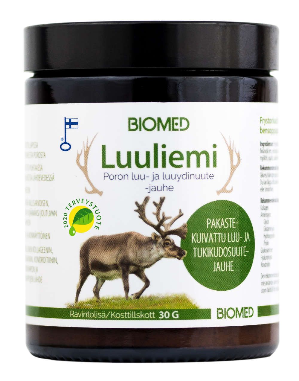 A jar of Biomed Lulilemi powder featuring a reindeer image on the label, Finnish text, a green health seal, and product information—and formulated with care—on a white background. The container is cylindrical plastic with a white screw cap and matte surface. Label includes sans-serif typography in black and green. No people or hands are present in the image. The photo is taken against a plain white backdrop.