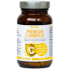 A brown plastic bottle labeled Biomed Premium C-Complex with 60 capsules, yellow and white text, and a gold shield icon on the matte label. The bottle has a white screw cap. The label includes Finnish text describing this vitamin C supplement capsule. Product is shown against a plain neutral background in a straight-on shot. No people or hands are visible.