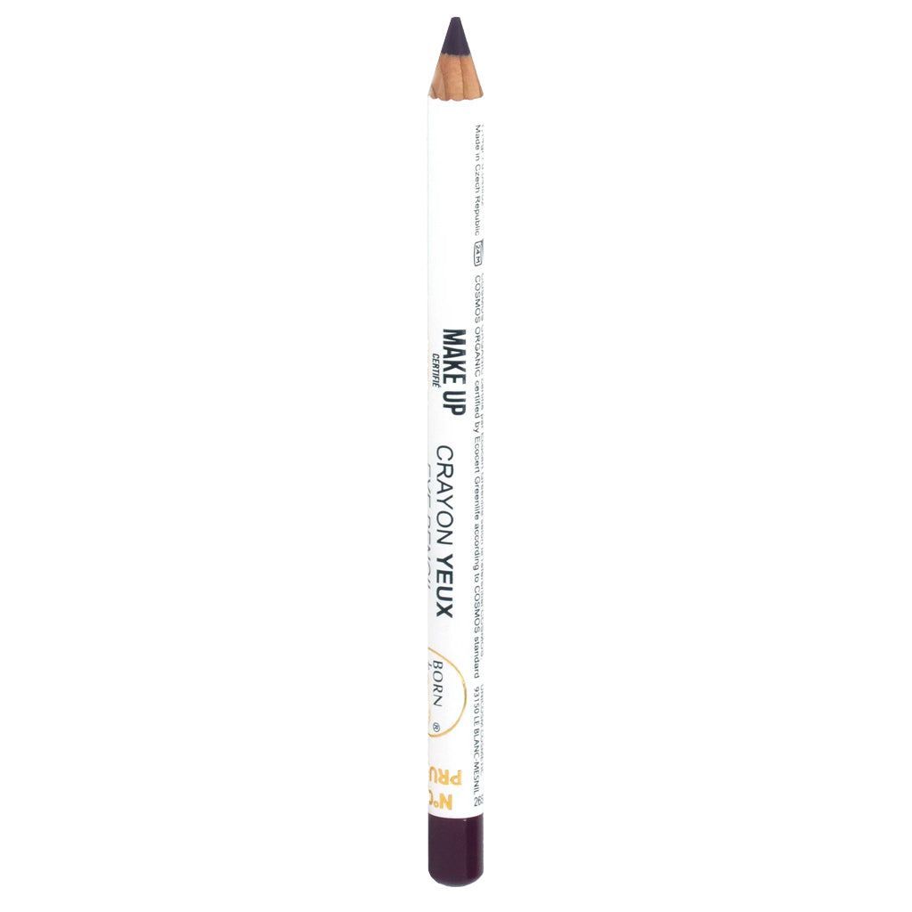 Valkoinen silmäkynä tumman kärjen kanssa, merkitty MAKE UP CRAYON YEUX ja NOIR; kynä pystyssä, kultaista ja mustaa tekstiä painettu sivulle; viimeistely mattainen metallisin yksityiskohdin etiketissä; muoto lieriömäinen kapenevalla kärjellä; ei pakkausta, käsiä tai muita esineitä näkyvissä; neutraali tausta, lähikuva tuotteesta.