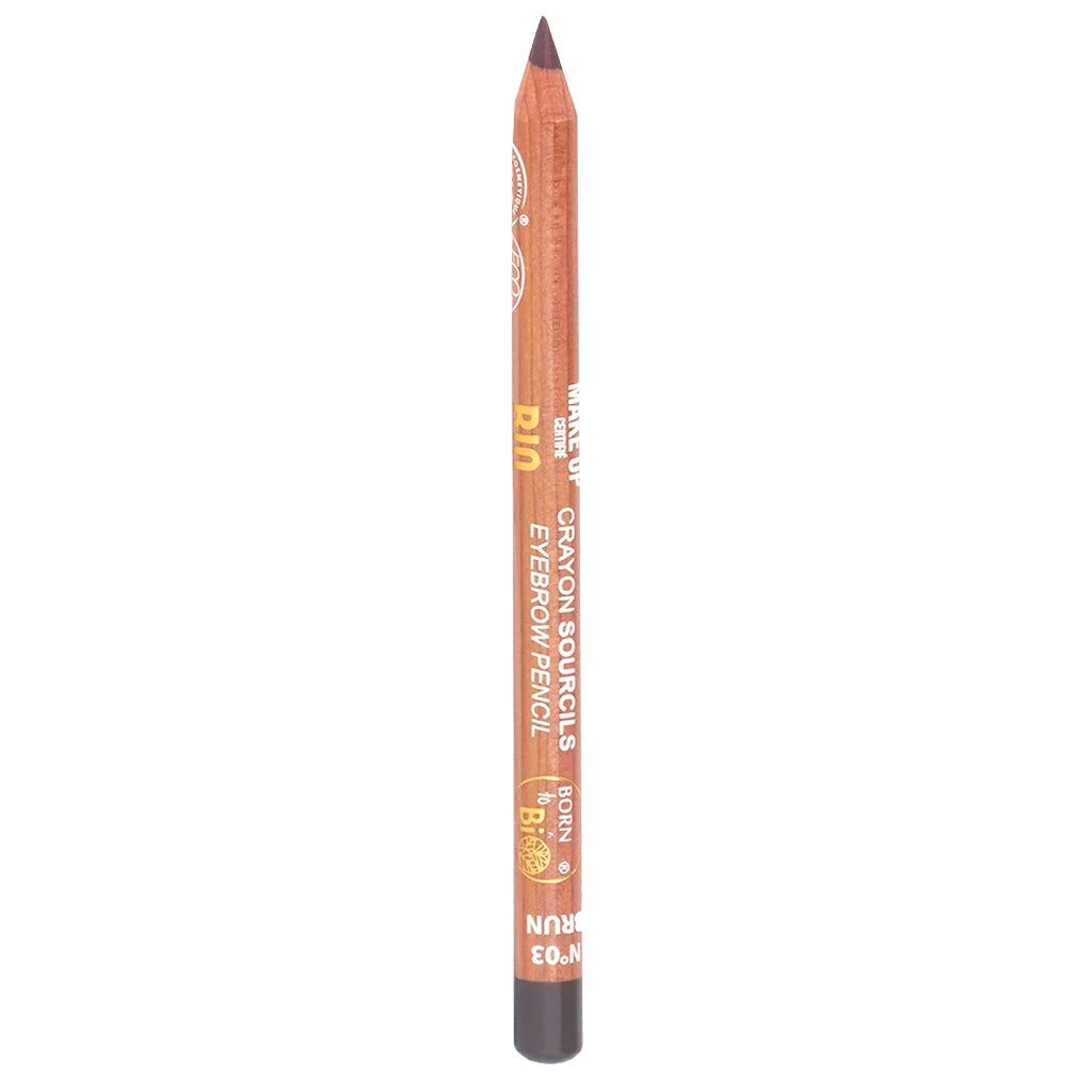 A brown eyebrow pencil stands upright on a white background. The pencil is cylindrical with a matte finish and no cap on the tip. It displays printed label text: “BROWN” and “EYEBROW PENCIL,” along with smaller text details. No packaging, people, or additional objects are visible in the image.