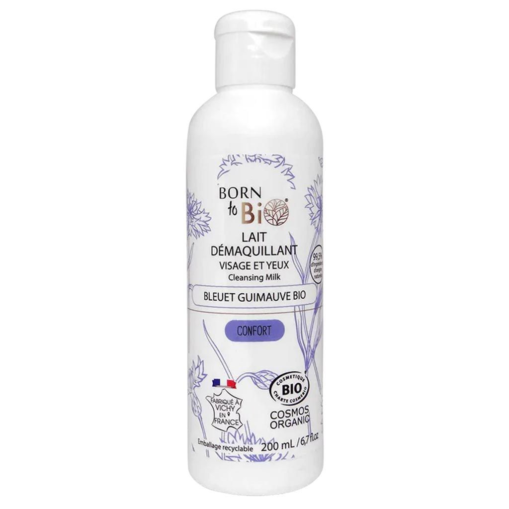 White bottle of Born to Bio Cleansing Milk with blue floral designs, labeled for face and eyes. This 200 ml product is organic, recyclable, and features eco-friendly French certifications. Cylindrical plastic container with a matte finish; printed label features modern sans-serif typography. Shot on a plain white background. No people or other objects in frame.