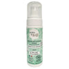 A bottle of Born to Bio Foaming Facial Cleanser with organic sweet almond and argan oil, featuring a white plastic pump dispenser and cylindrical shape. The green label is matte, with white bold sans-serif text and detailed botanical drawings. Product title and key ingredients are legible. The product is shown against a plain background.
