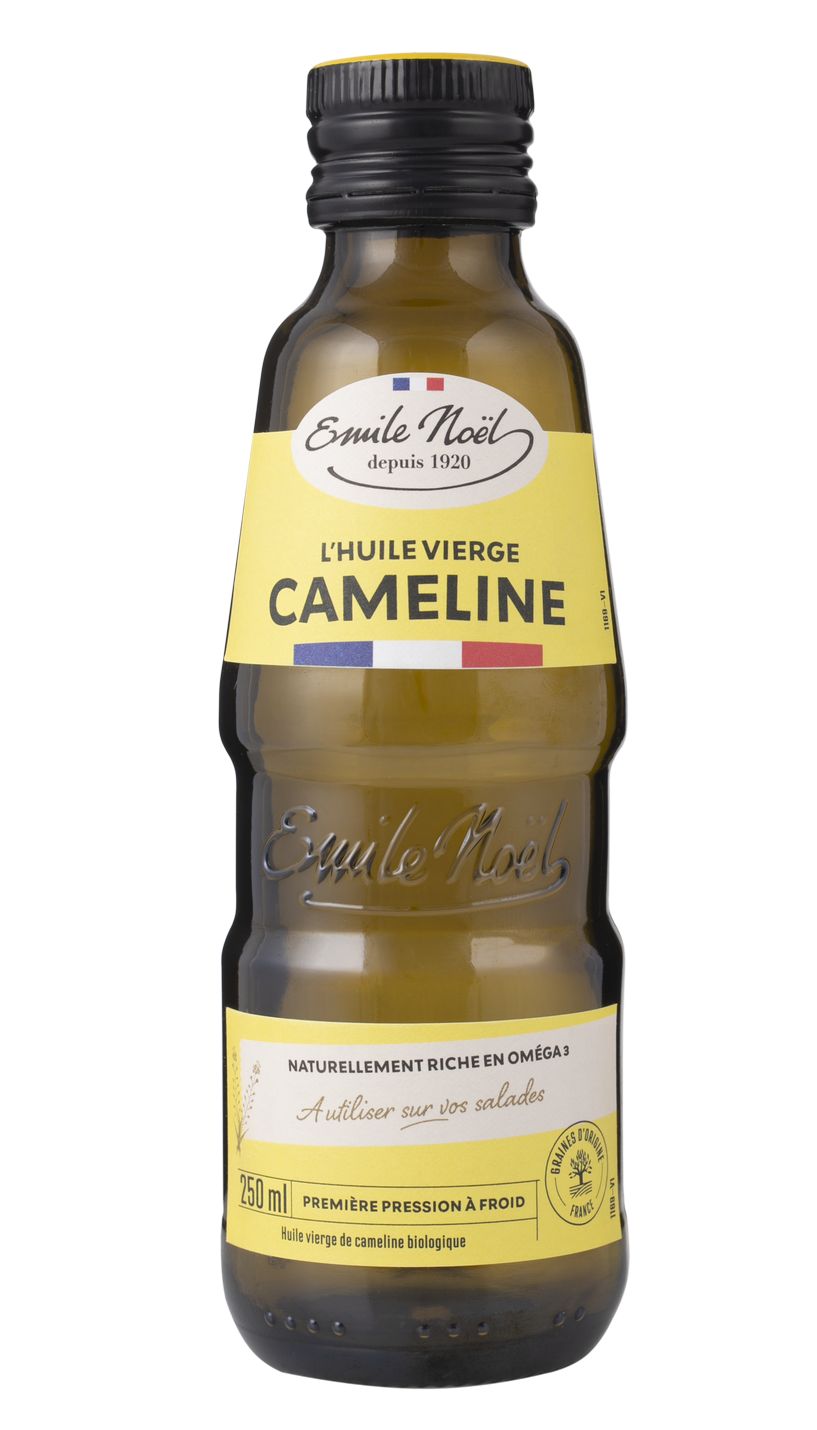 A 250ml bottle of Emile Noël organic virgin camelina oil with a yellow label and black cap, naturally rich in omega-3, perfect for drizzling over salads. The transparent glass bottle is cylindrical with a glossy finish. The label is bright yellow with dark green sans-serif and script text displaying the product name and details. The cap is solid black plastic with a matte surface. Photo background is plain white; no people, hands, or props are visible. Product centered in the frame, standard front-facing