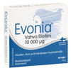 A box of Evonia Vahva Biotiini 10,000 µg biotin tablets is shown, rectangular with a glossy surface. The design features blue and white colors and a graphic outline of a woman’s face with flowing hair. Main label uses bold sans-serif type; secondary text is smaller. The box reads “Evonia Vahva Biotiini 10,000 µg,” mentions 60 tablets, and includes Finnish text. Neutral background with no people visible.