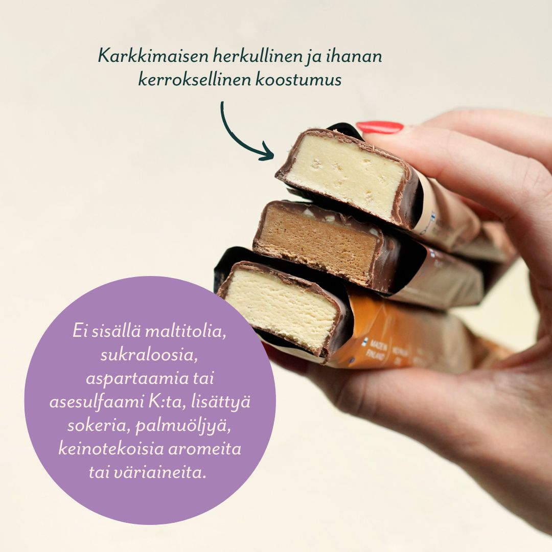 A hand holds three chocolate-covered ice cream bars stacked together. The bars are oval-shaped with a glossy chocolate coating. Finnish text in large, clear sans-serif font is present on the image, describing their creamy, layered texture and listing no maltitol, sucralose, aspartame, or artificial additives. Plain background. Close-up shot.
