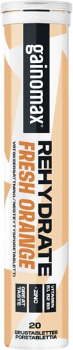 A tube of Gainomax Rehydrate Fresh Orange effervescent tablets, containing 20 tablets. Cylindrical plastic tube with a matte label, orange and white color scheme, and bold sans-serif typography. The label highlights vitamin B12 and zinc as main ingredients. The product is photographed against a plain background with no people visible.