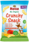 Bag of Holle Bio Organic Crunchy Snack, millet-mango flavor, for babies 8 months and older. The packaging is matte plastic in light yellow-orange tones with a gusseted base, upright rectangular shape. Illustrated puffs, mango slices, millet grains, and two cartoon monkeys are printed on the front. Product name appears in simple sans-serif font; text is multilingual. Plain studio background, no people present.