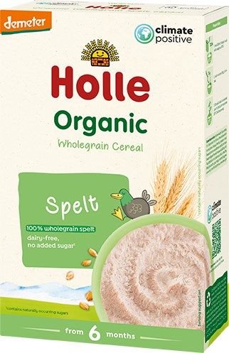 A box of Holle Organic Wholegrain Spelt Cereal for babies from 6 months, featuring a green duck, wheat, and a bowl of cereal on the front. This climate positive cereal is dairy-free and contains no added sugar. The box is rectangular with a matte finish and predominantly cream and yellow colors. Simple serif font displays product information. Packaging placed against a plain white background in a straightforward product shot. No people or hands are visible.