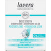 Lavera shampoo bar box with blue water splash, labeled Basis Sensitiv, Moisture & Care, Organic Aloe Vera & Jojoba Bio, for normal and dry hair—formulated with 0% plastic. Rectangular cardboard packaging is light blue and white with a matte finish. Sans-serif typographic hierarchy is used on the front. Product photo is clear with no people or objects in the background.