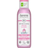 A pink plastic bottle of Lavera Naturkosmetik Body Wash with a matte finish, slim cylindrical shape, and flip-top cap. Front label shows “Indulgent Rilassante,” “organic wild rose and cotton,” vegan and climate-neutral claims, and floral graphics. Branding uses bold sans-serif text. No people or hands are present. Neutral background with standard product shot framing.