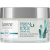 A jar of Lavera Hydro Refresh Creme-Gel with a white lid and label featuring blue seaweed graphics and text about bio-algae, hyaluronic acids, and hydration. The container is cylindrical with a glossy finish. The label uses sans-serif font for product information. The photo shows no people or props; background is plain and neutral, shot straight-on at eye level.