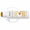 White bottle of Lavera Repair & Deep Care Shampoo with an open yellow cap. The container has a smooth, matte finish and curved edges. Black and gold text is printed on the label, which includes words about argan oil and bio certifications. The bottle is placed on a white background next to two smears of creamy shampoo. No people or hands are visible in the image.