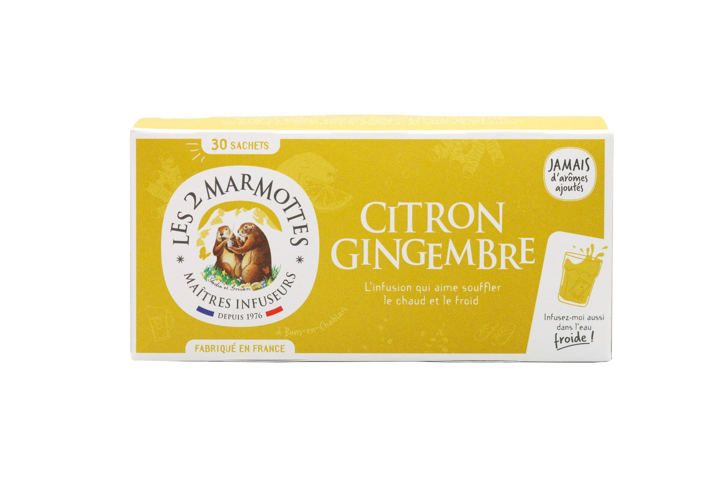A box of Les 2 Marmottes Citron Gingembre herbal tea, featuring yellow and white colors, two marmot illustrations, and French text highlighting its lemon-ginger flavor. The box is rectangular with a matte finish. Main label uses bold sans-serif typography in black and dark yellow. No people or hands are present. The background is plain white with even lighting, shot at eye level.