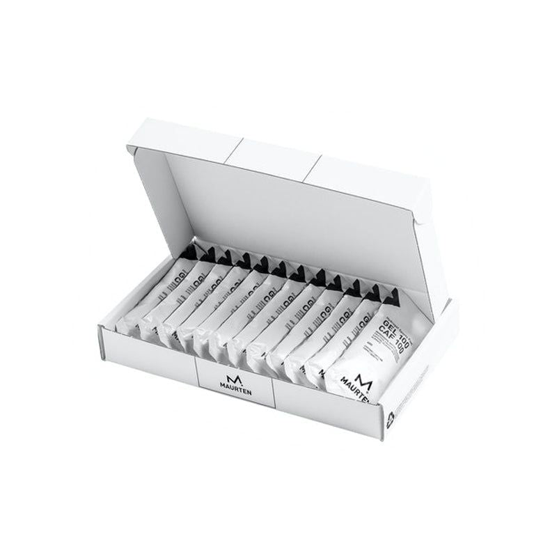 An open white box containing several individually wrapped Maurten hydrogel energy gel sachets, arranged in neat rows with visible branding on the packaging. Box and packets display a matte finish; sachets are rectangular, mostly black with bold white sans-serif text displaying “Maurten”. No people or hands present. The background is plain and light-colored, shot from above.