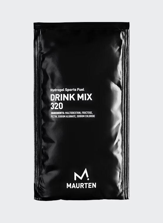 Black sachet labeled Hydrogel Sports Fuel Drink Mix 320 by Maurten, featuring minimal white text, logo, and a list of ingredients on a plain background. The packaging is rectangular with a matte finish. Typography is sans-serif in uppercase. No people or hands are present. The shot shows the full sachet from the front against an unobtrusive, solid background.