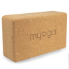 A myoga cork yoga block with a heart symbol engraved on one side, displayed on a white background. The rectangular block has rounded edges and corners, natural cork color, matte finish, and visible cork texture. The engraving shows a simple heart outline without additional text. The product is photographed alone with no packaging or people present, shot from an angled front view.