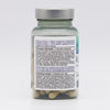 A clear cylindrical bottle with a reflective silver screw-on lid contains multiple beige capsules. The bottle’s white label features black sans-serif text presenting supplement ingredients and dosage instructions in Finnish, Swedish, and English. Product is photographed upright on a plain white background. A clear bottle with a silver lid containing capsules. The label on the bottle lists supplement ingredients and dosage instructions in Finnish, Swedish, and English. The beige capsules inside are