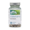 A bottle labeled Valeriana featuring an image of white valerian flowers, containing 60 capsules and displaying the Natura Media logo. The label highlights the calming properties of valerian. The bottle is cylindrical with a white matte finish and has a plastic screw cap. Typography on the label includes bold black font for the product name and smaller sans-serif text for details. Product is shown against a plain white background in a frontal shot. No people or hands are visible in the image.