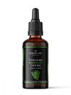 A brown glass dropper bottle with a matte label is shown upright against a plain white background. The label displays the brand name NORDICURE and product name Thyme (Thymus vulgaris) in clear sans-serif type, along with hand-drawn thyme sprig illustrations and text in Finnish, including the word “Timjami.” No people or hands are present.