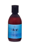 A brown plastic bottle with a black screw cap, cylindrical shape, and a glossy finish. The blue front label displays white illustration graphics of birds and waves. Sans-serif typography is used for the brand and product information, reading “Meri Aava Ole Hyvä shampoo & shower gel, 300ml”. Product placed against a plain background. No people or actions visible.