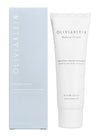 A light blue rectangular box and a white cylindrical tube, both with a matte finish, feature sans-serif typography labeling them as OLIVIAKLEIN Balance Cream, a soothing rose water moisturizer, 50 ml. Packaging displays English and Finnish text. Both items are upright against a neutral background with no visible hands or props.