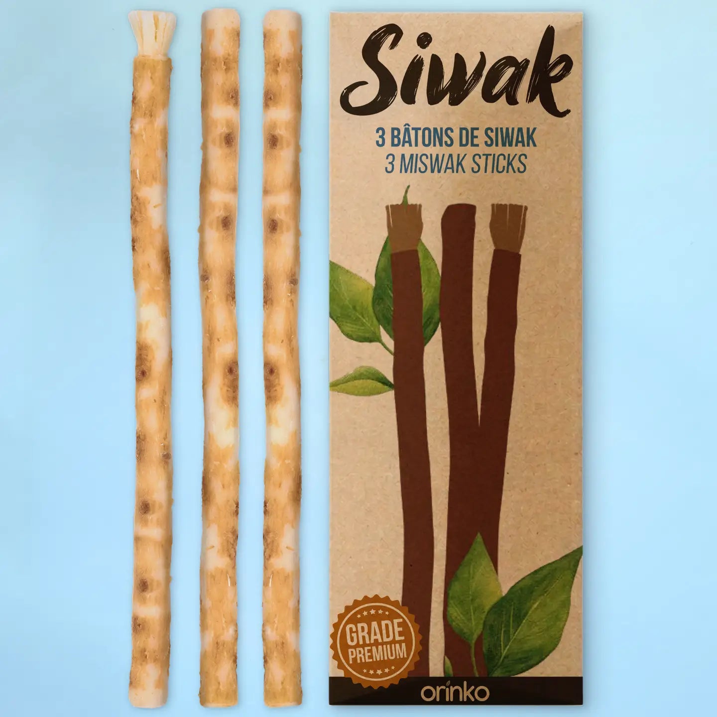Kolme Orinko Miswak-puutikkua ja niiden kraft-pahvipakkaus, valmistettu Salvadora persica -puun juuresta