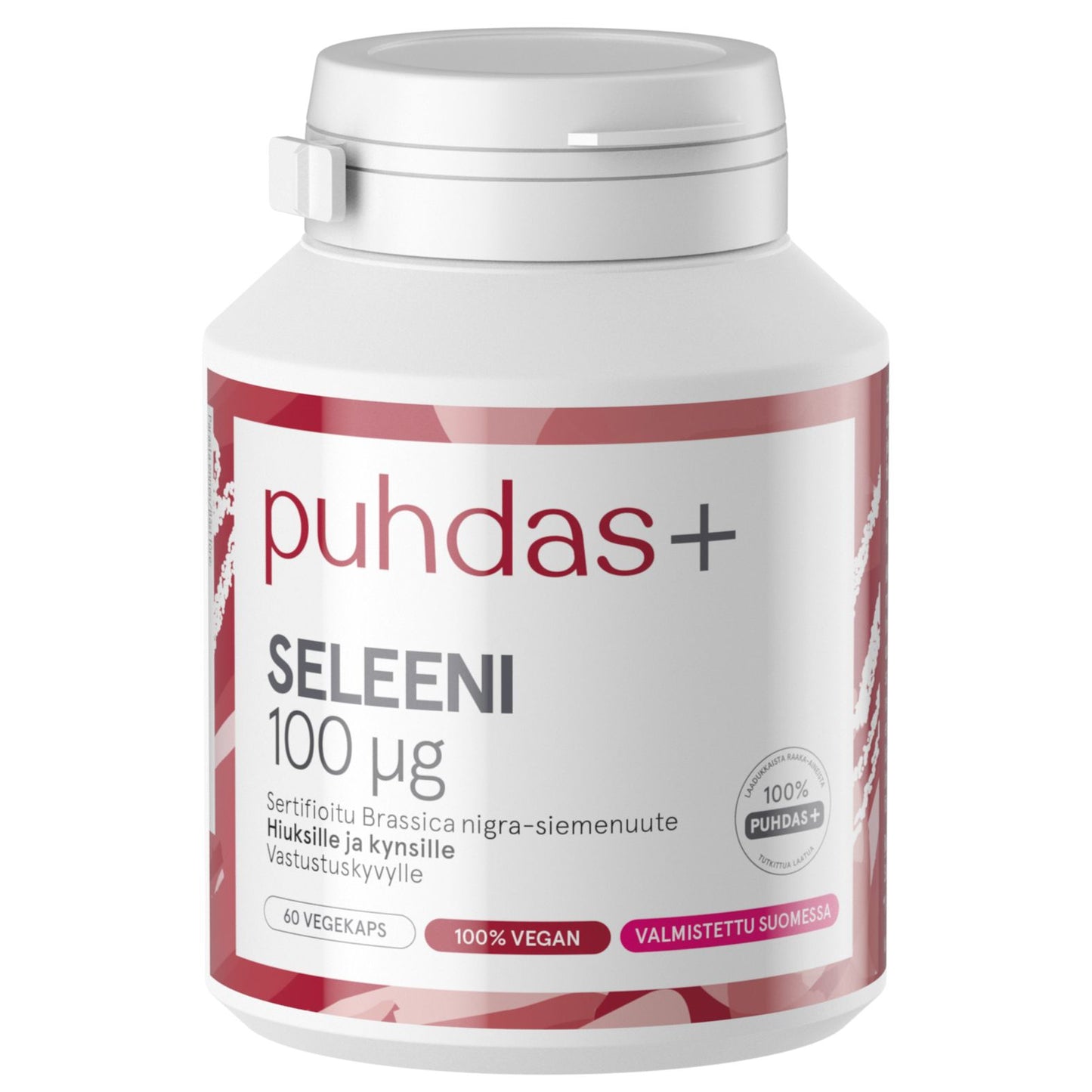 puhdas+ SELEENI 100 μg -pullo, valkoinen sylinterimäinen muovipullo mattapinnalla, lihavoitua punaista ja pinkkiä graafista korostusta sekä tekstausvapaata typografiaa; etiketissä selkeästi mainittu vegaanisuus, 60 kapselia ja valmistus Suomessa; tausta yksinkertainen ja huomaamaton; ei ihmisiä tai käsiä näkyvissä.