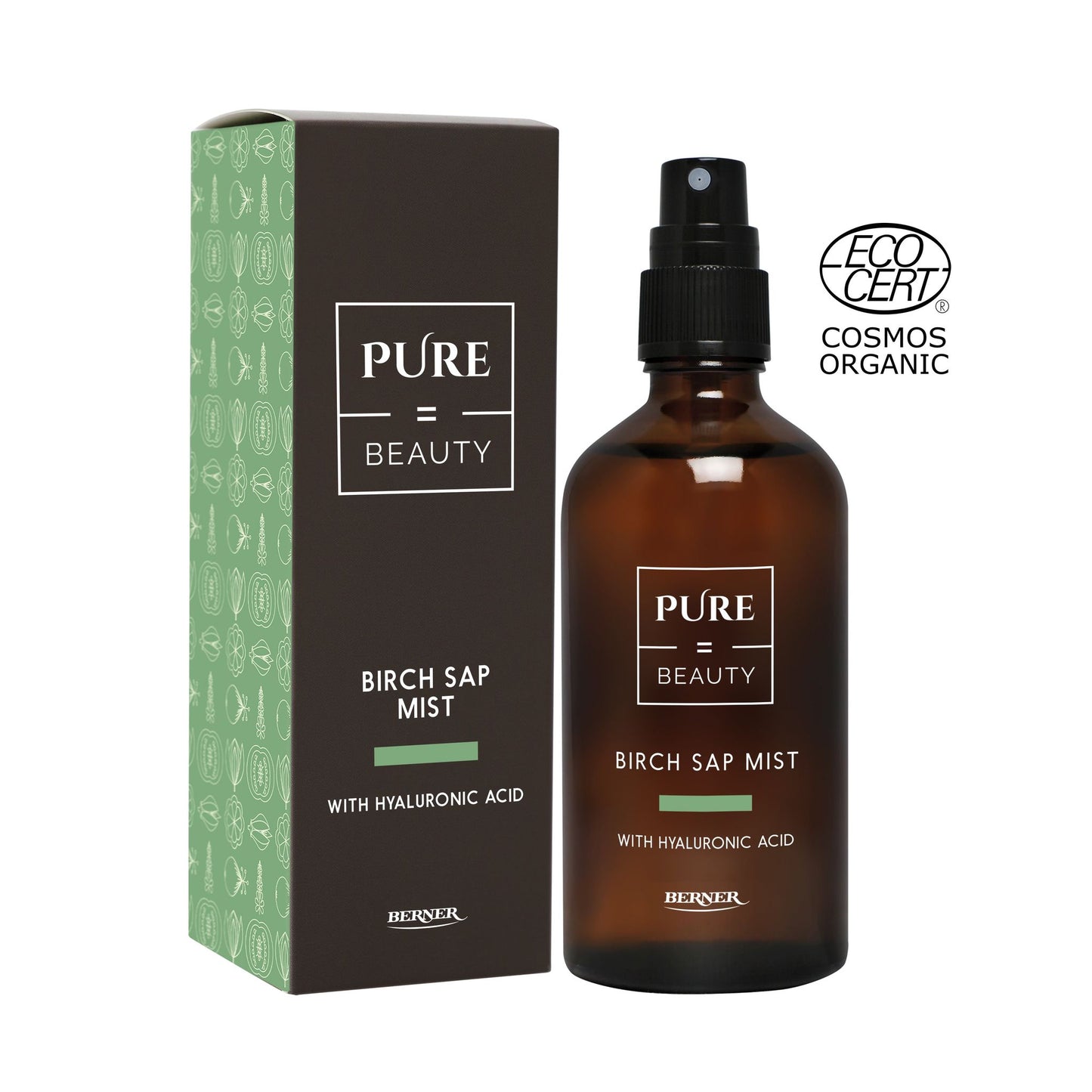 A brown spray bottle labeled Pure Beauty Birch Sap Mist with Hyaluronic Acid stands next to its green box. The spray bottle has a matte finish and cylindrical shape, the packaging features sans-serif typography. The ECOCERT Cosmos Organic logo is visible in the upper right corner. Neutral background, no people present. Product and box are upright in a studio-style image.